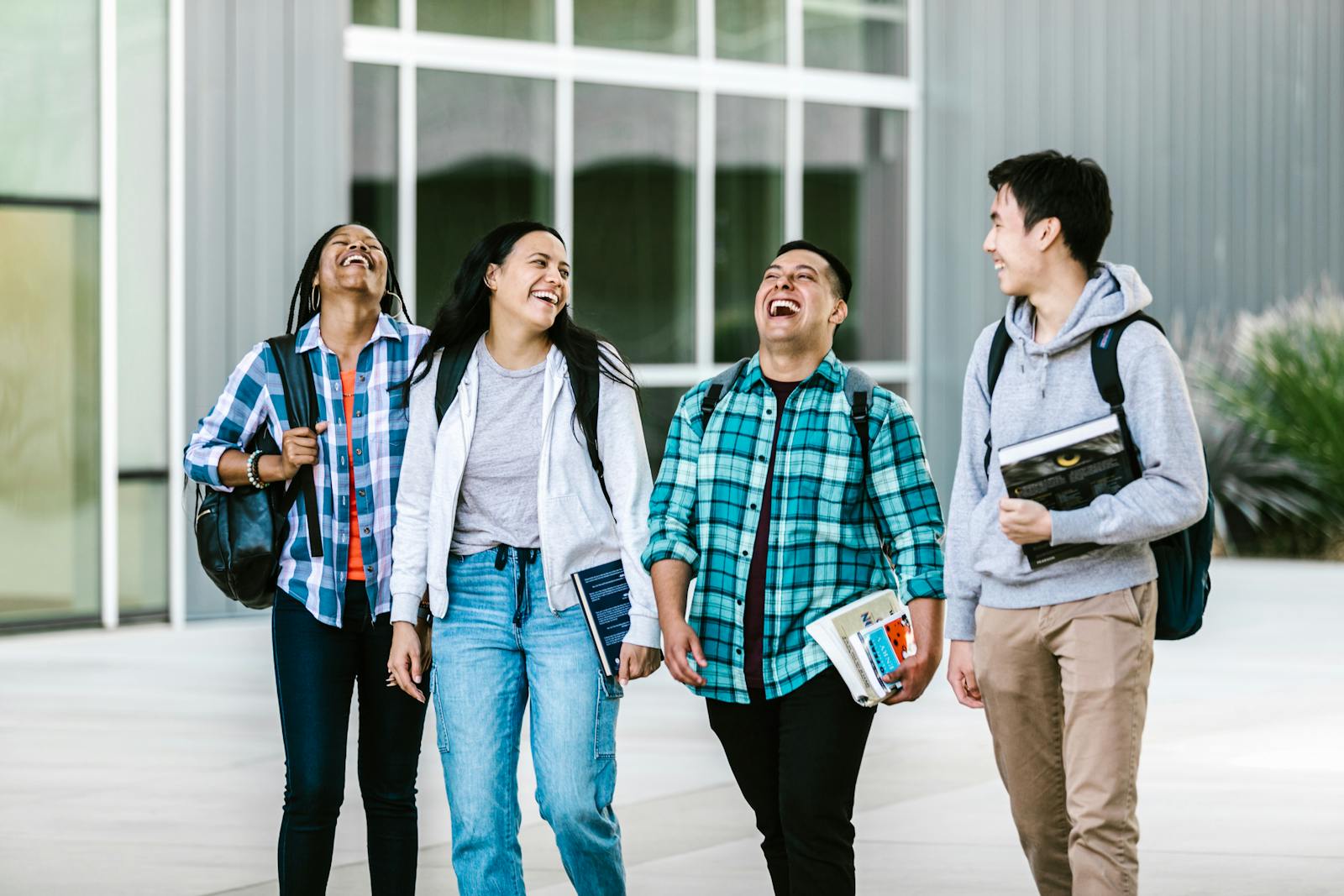 College students walking together outdoors on campus during a sunny visit day