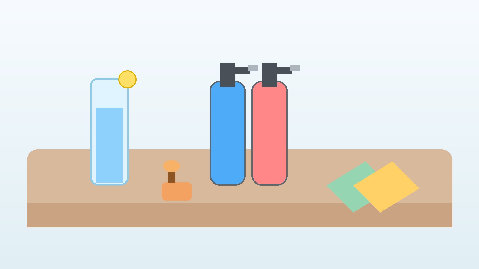 Glass of water and cleaning supplies set out on a table for spring cleaning